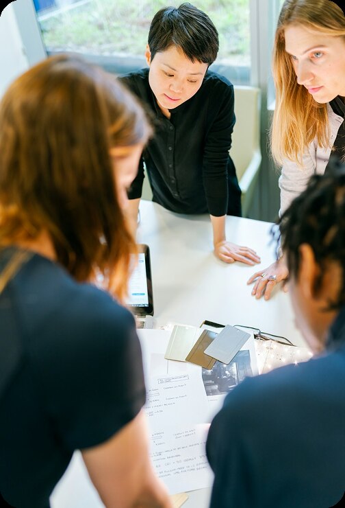A team reviewing documents together around a table